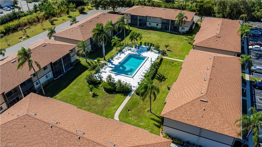 Aerial view of residential area featuring a pool