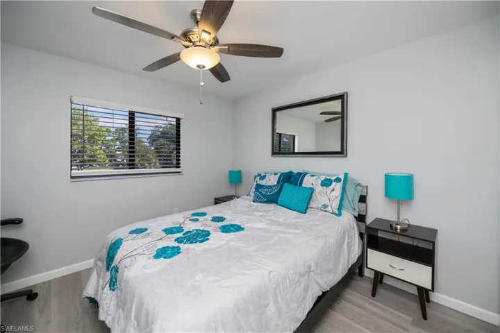 Bedroom with light wood-style floors and ceiling fan
