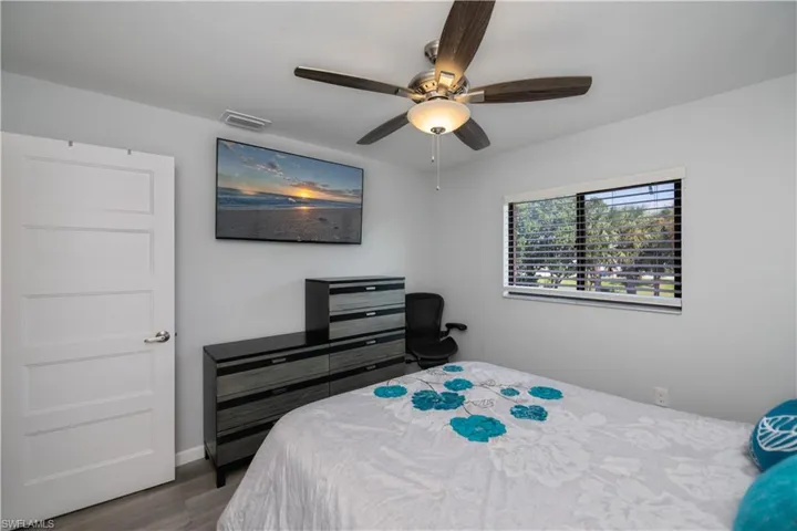 Bedroom featuring wood finished floors and ceiling fan