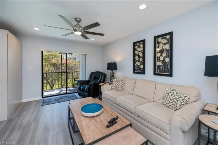 Living area featuring wood finished floors, recessed lighting, and ceiling fan
