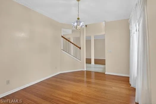 Formal dining area with view of staircase