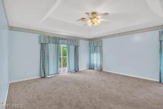Spacious primary suite with sliders to screened balcony