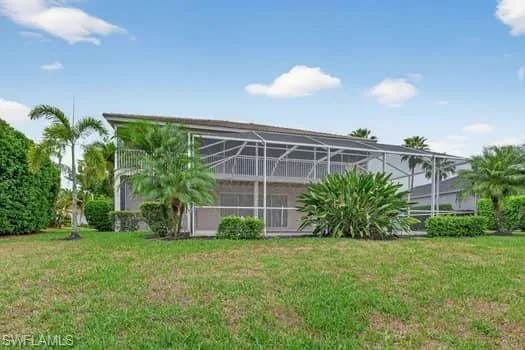 Back yard with view of property