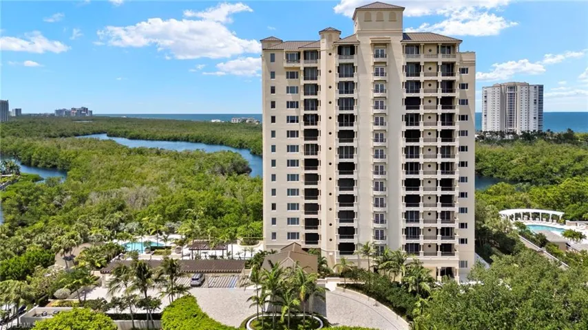 View of apartment building / complex featuring a water view
