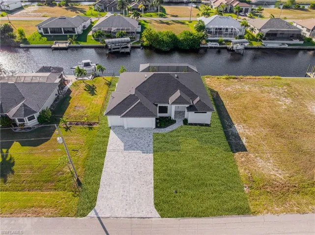 Aerial view of residential area with a nearby body of water