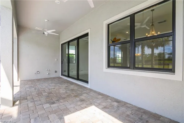 Covered outdoor living space includes pre-plumbed outdoor kitchen and access to natural gas for your grill.