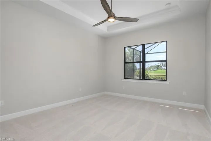 Owner suite is located at the back of the home and includes tray ceiling with crown molding, and provides beautiful water views.