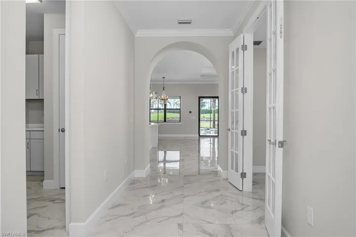 HIgh ceilings with crown molding in all common areas provides that added decorative touch.