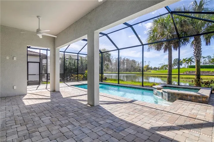 Spacious under cover lanai with pool and spa and great water view.