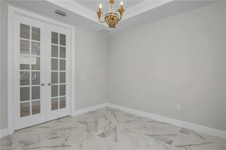 Spacious Den is the perfect work from home office, or use as an additional bedroom for guests.