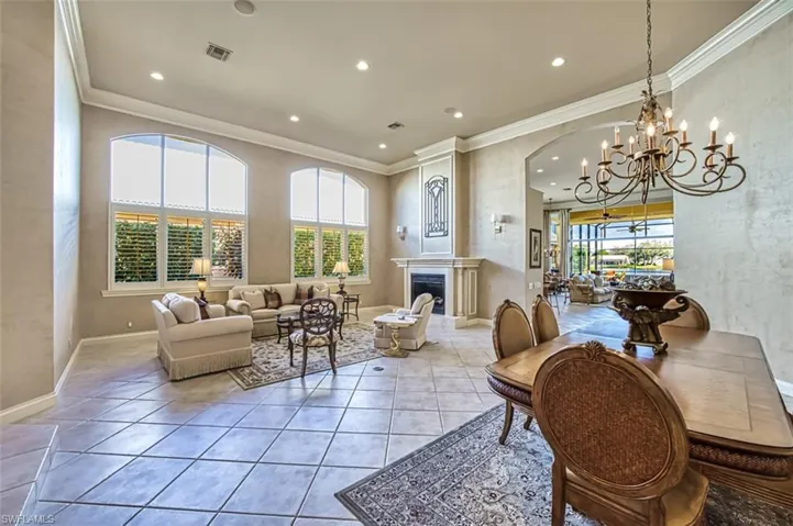 Oversized arched windows in living room and dining area for all the natural light you can ask for