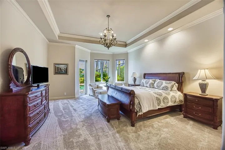 1st floor primary bedroom with entrance to lanai