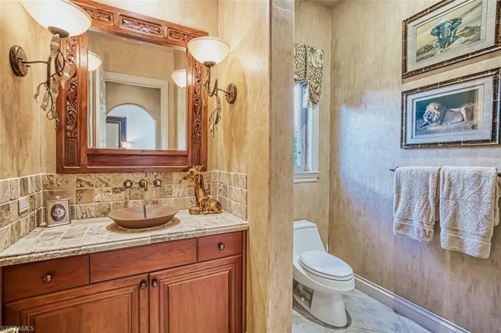 Downstairs guest bathroom with walk in shower off of den