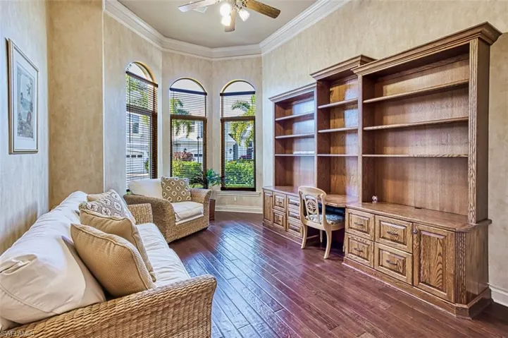 Bright den with tall windows can also convert to a 4th bedroom