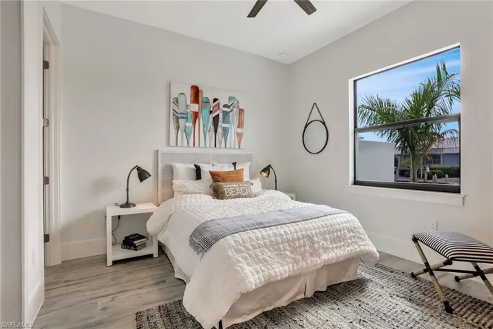 Bedroom featuring light hardwood / wood-style flooring and ceiling fan