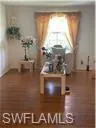 Unfurnished office featuring hardwood / wood-style flooring