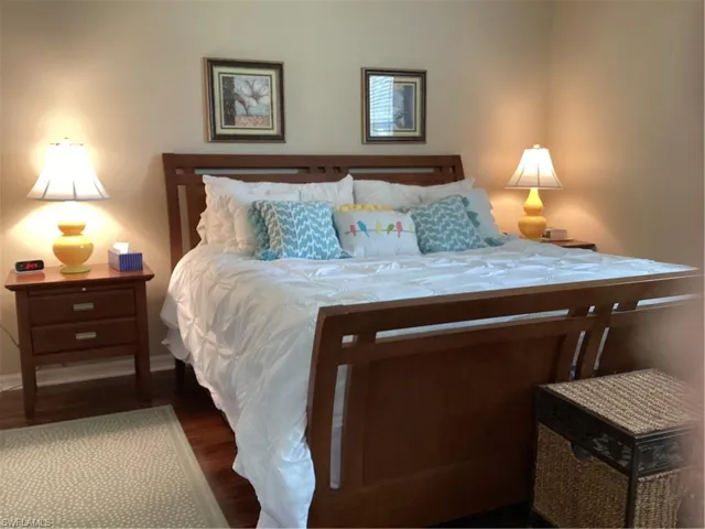 Bedroom featuring dark wood-type flooring