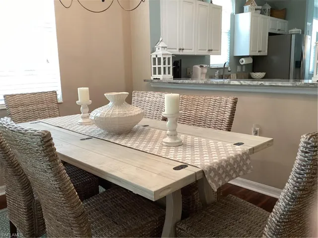 Dining area with hardwood / wood-style floors