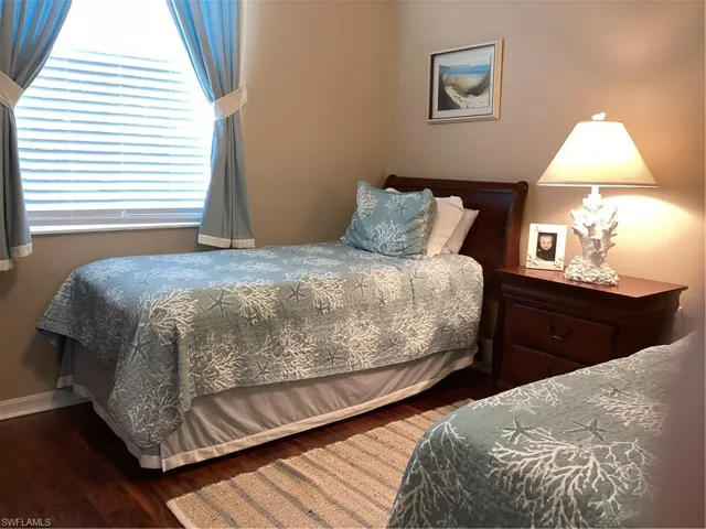 Bedroom featuring dark hardwood / wood-style flooring