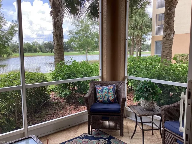 Sunroom / solarium with a water view