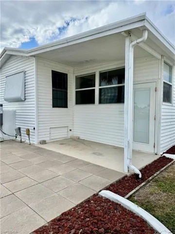 Property entrance with a patio area