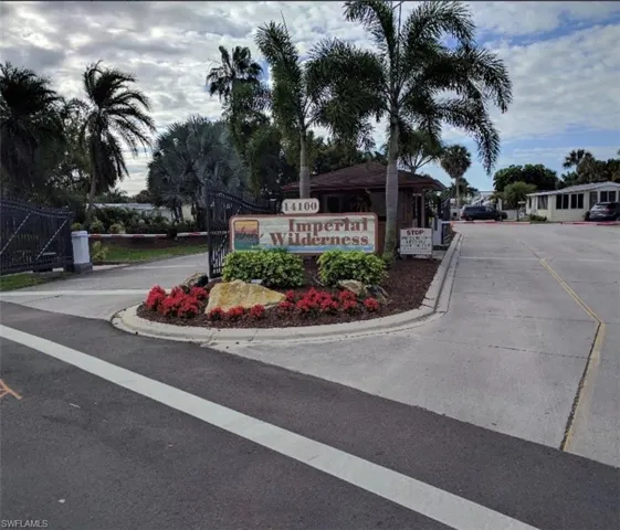 Community sign featuring a gate