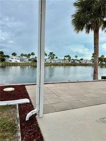Dock with a residential view and a water view