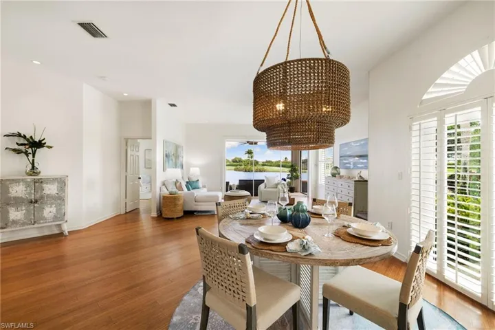 Dining space featuring a chandelier and wood finished floors