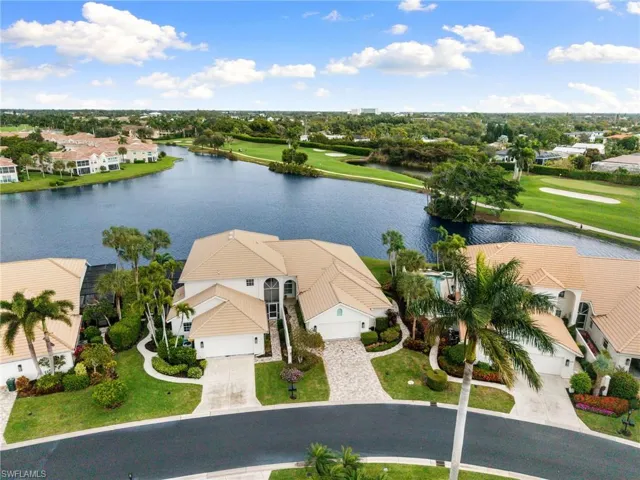 Drone / aerial view of a local golf course and a large body of water