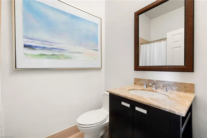 Full bath with vanity and a shower with curtain