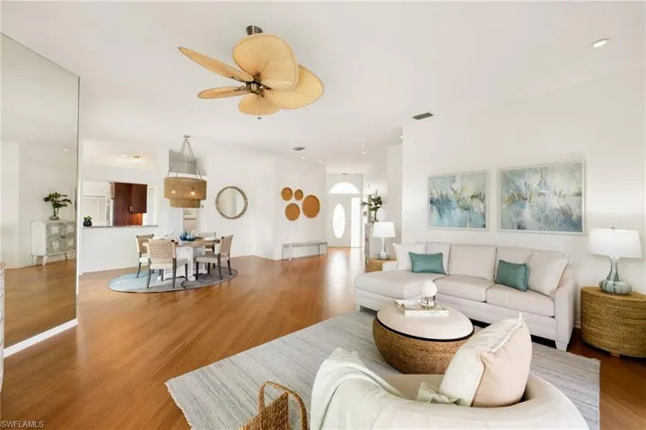 Living room featuring recessed lighting, wood finished floors, and ceiling fan