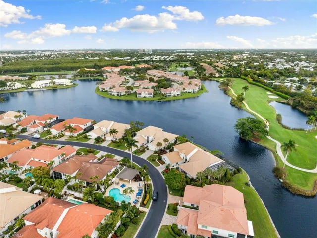 Aerial perspective of suburban area featuring a large body of water