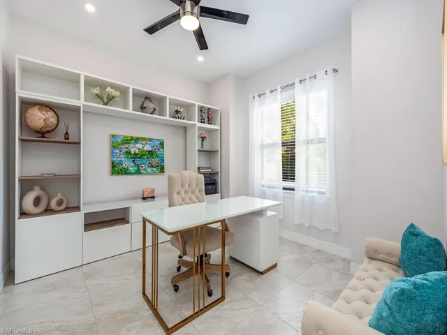 Office space featuring ceiling fan and recessed lighting