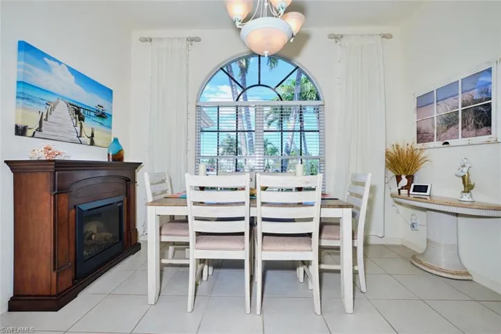 Dining area with fireplace and tray ceiling