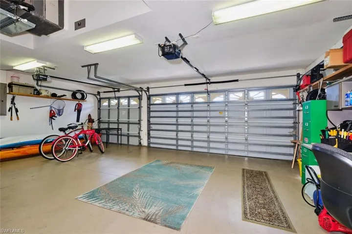 Garage featuring a garage door opener