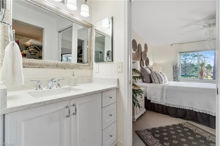Bathroom featuring vanity and ceiling fan