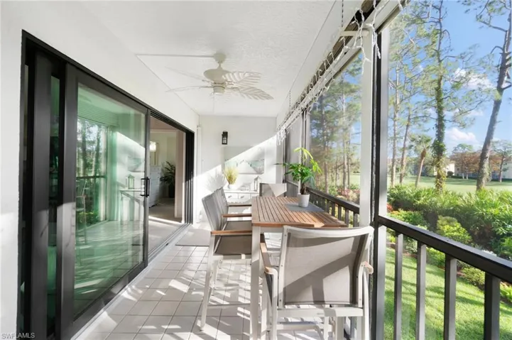 Sunroom featuring ceiling fan and a healthy amount of sunlight