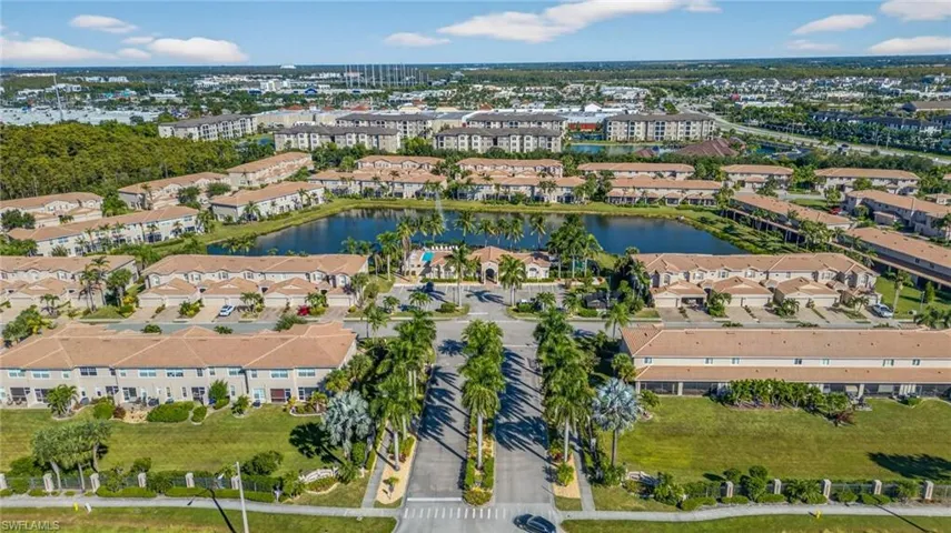 Aerial view of property and surrounding area featuring a large body of water