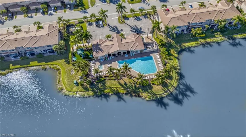 Drone / aerial view of a large body of water and a pool