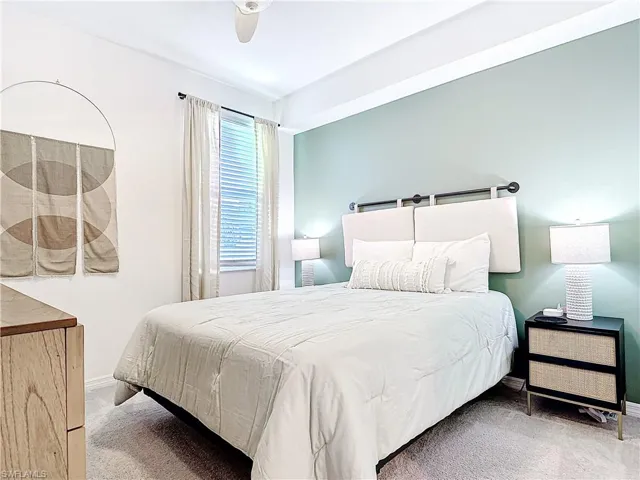 Bedroom with carpet flooring and ceiling fan