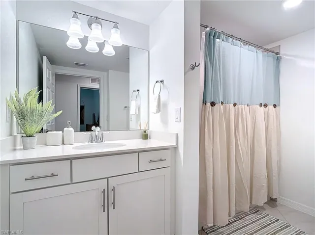 Bathroom featuring vanity and tile patterned floors