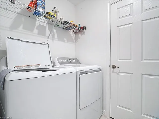 Laundry room featuring independent washer and dryer