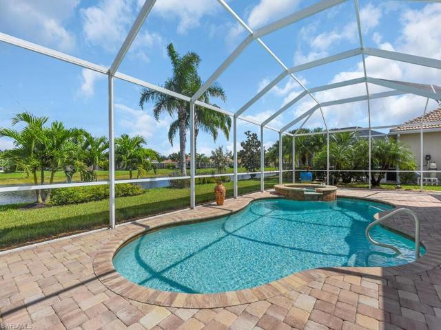 Screened  heated pool and above ground built-in spa on large lanai