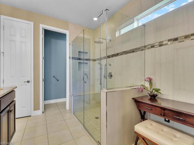 Primary bathroom with large modern glass shower enclosure
