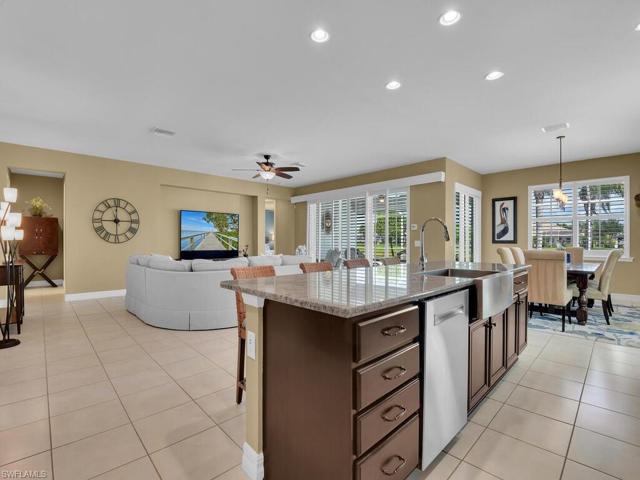 Rich wood cabinetry, stainles appliances, granite countertops and walk-in pantry