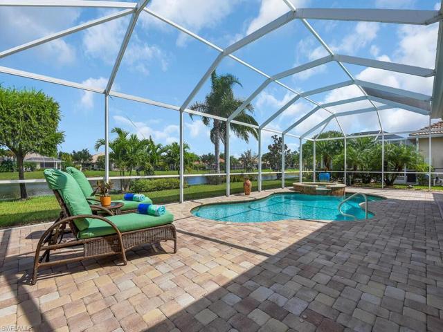 Screened  heated pool and above ground built-in spa on large lanai