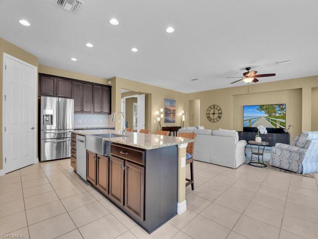 Rich wood cabinetry, stainles appliances, granite countertops and walk-in pantry