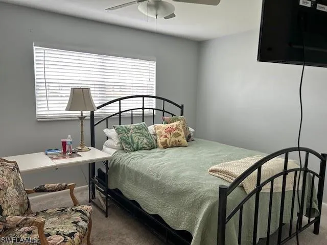 Bedroom with carpet flooring and ceiling fan