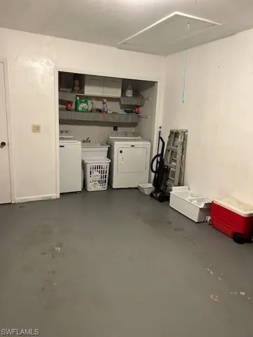 Garage featuring separate washer and dryer
