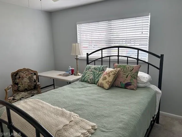 Bedroom with carpet and a ceiling fan